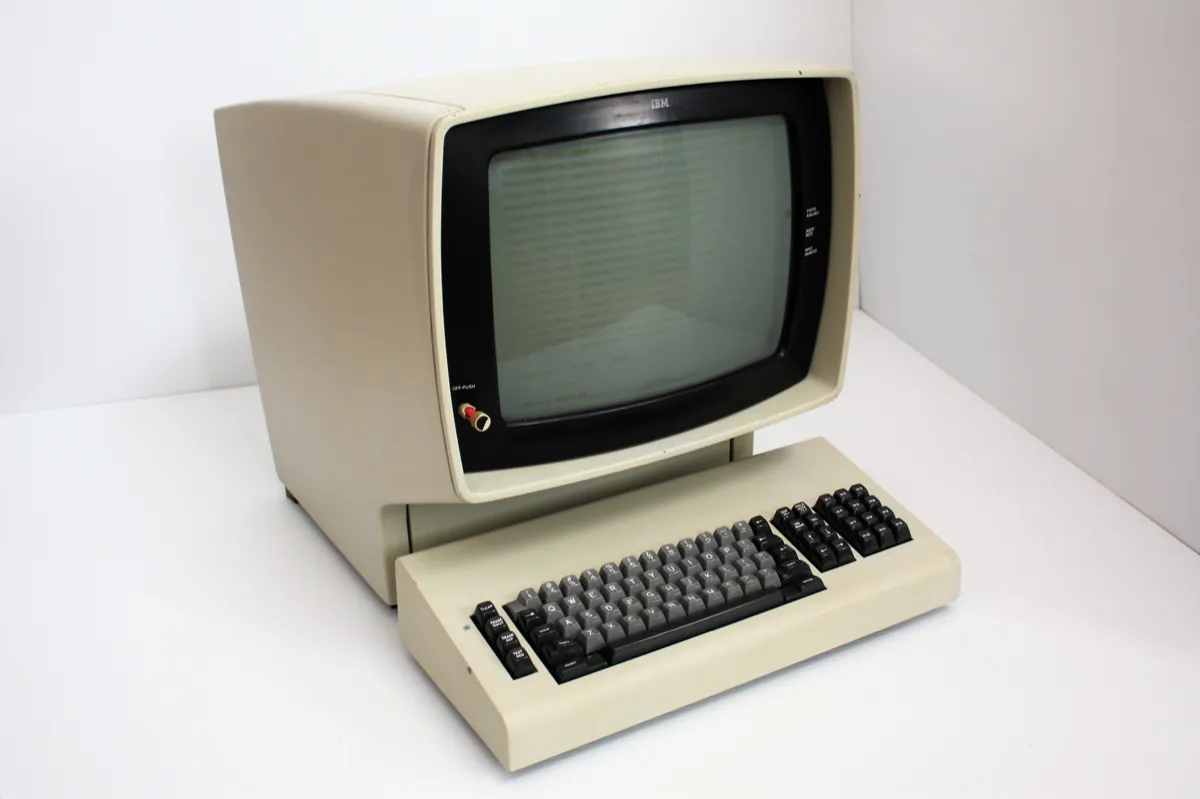 An IBM 3278 display station: a beige terminal with a green screen and a separate keyboard.